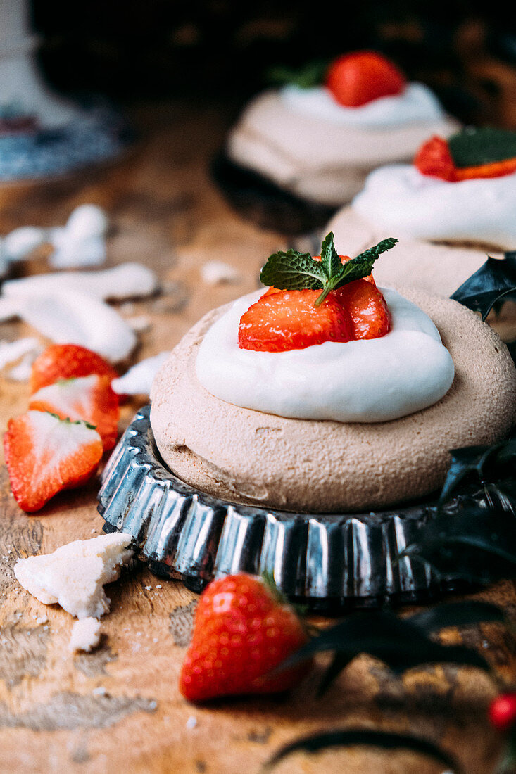 Christmas merengue with whipped cream and strawberries