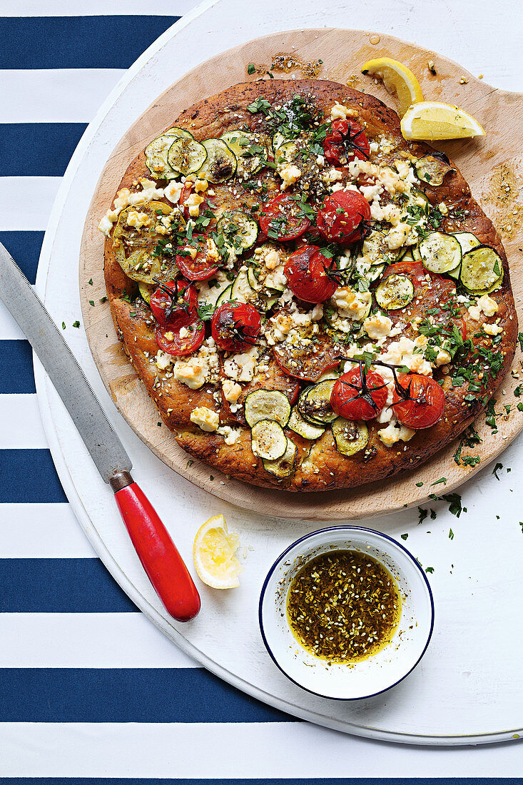 Spiced tomato Afghan pizza with dukkah and feta