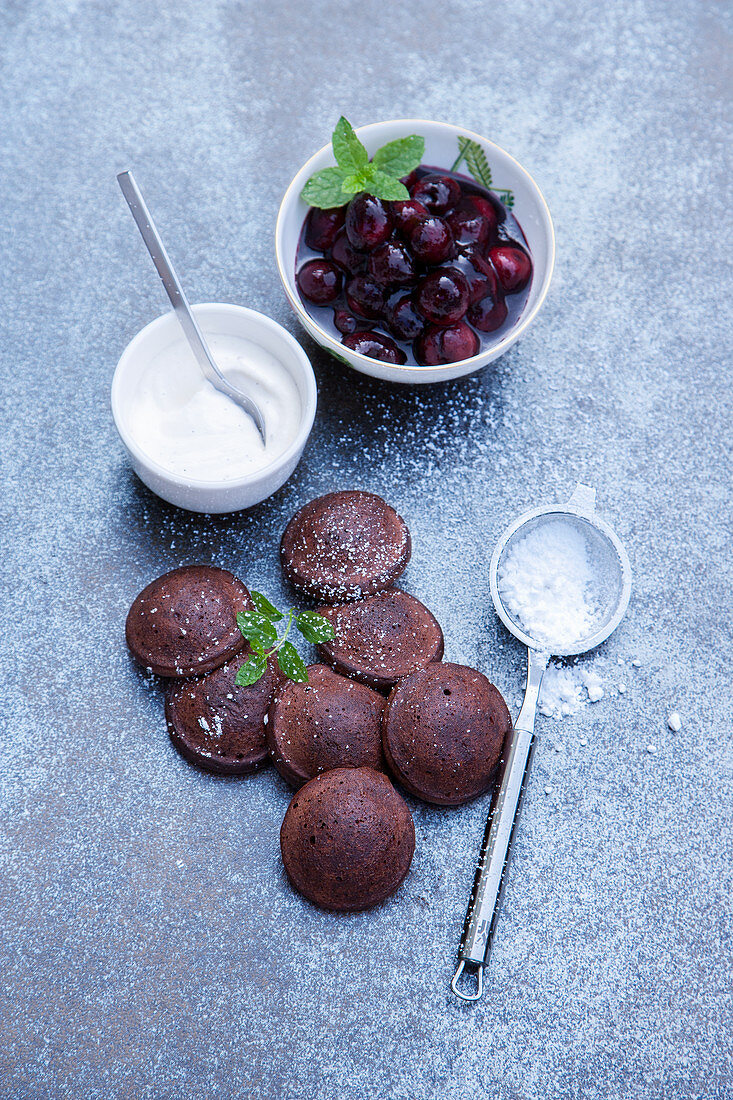 Grilled chocolate blinis with cherries with vanilla cream