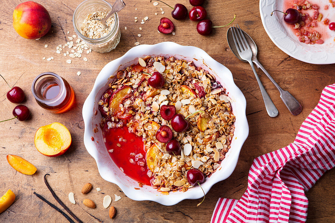 Peach and berry crumble in a baking dish