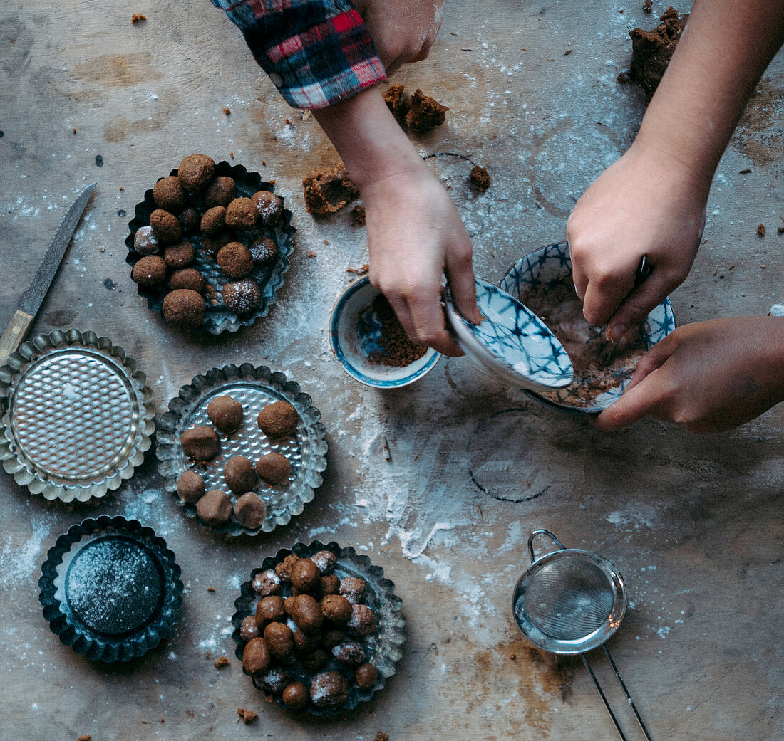 Children baking gingerbread biscuits for St. Nicholas Day