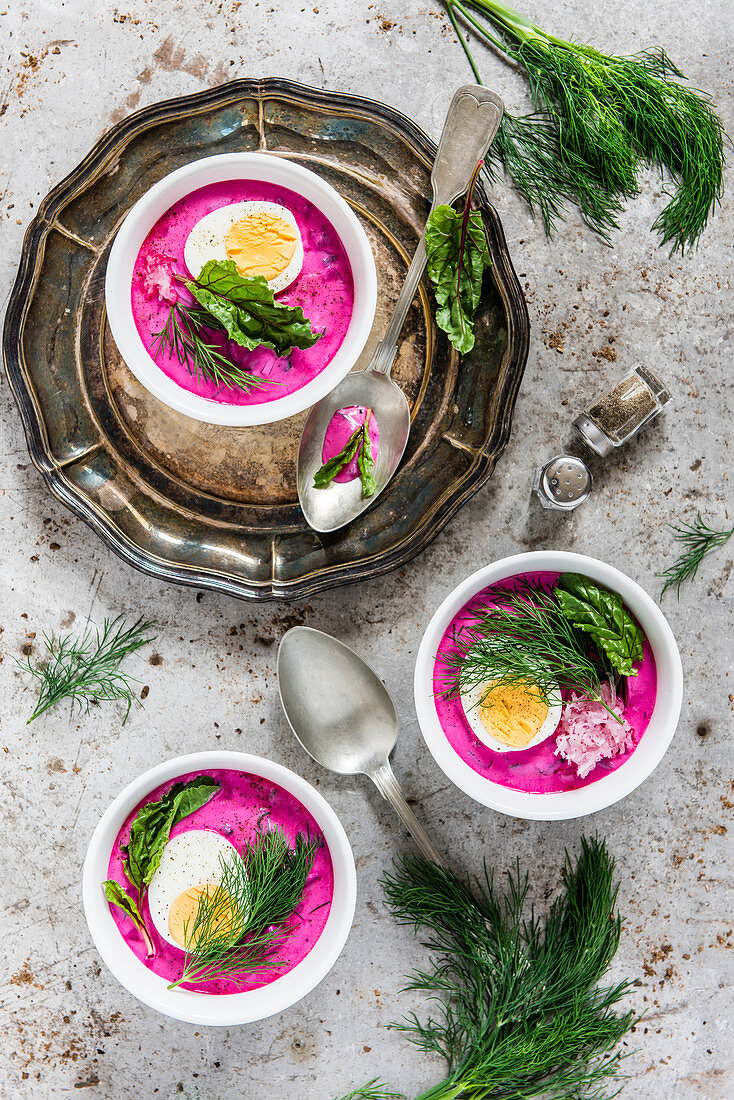 Cold borsch served with egg and dill