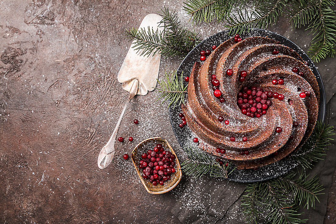 Gingerbread Bundt Cake for Christmas with lingonberry and christmas decorations