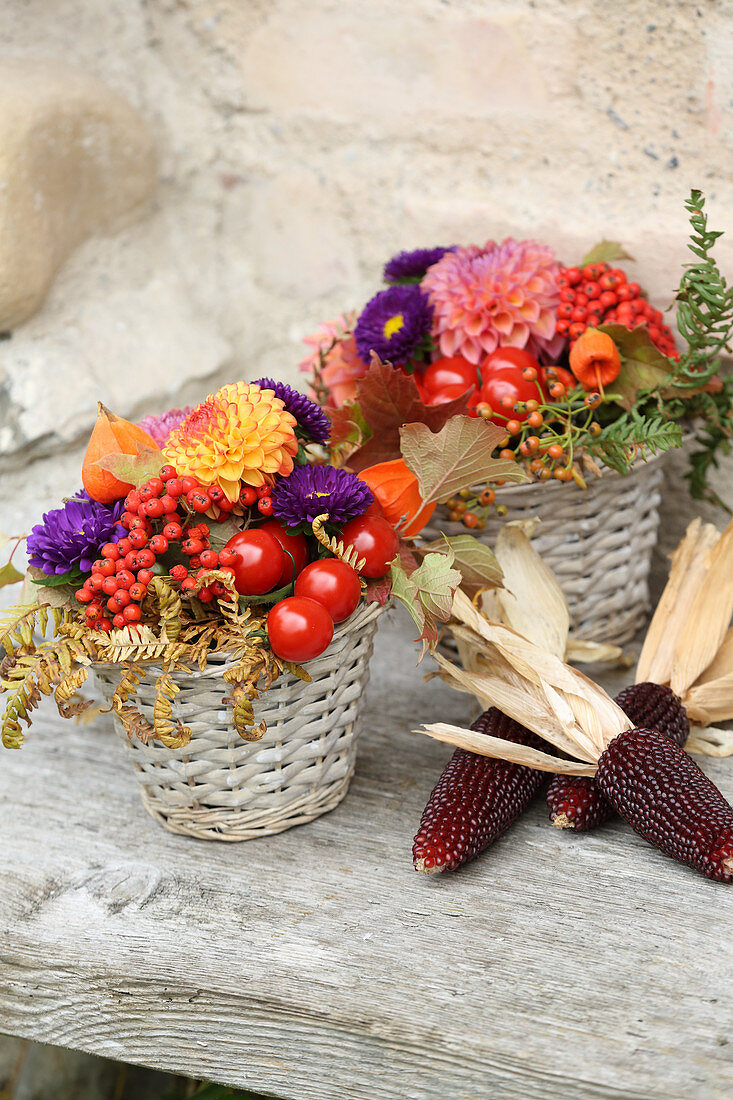 Rustic autumn arrangement of flowers and corn cobs