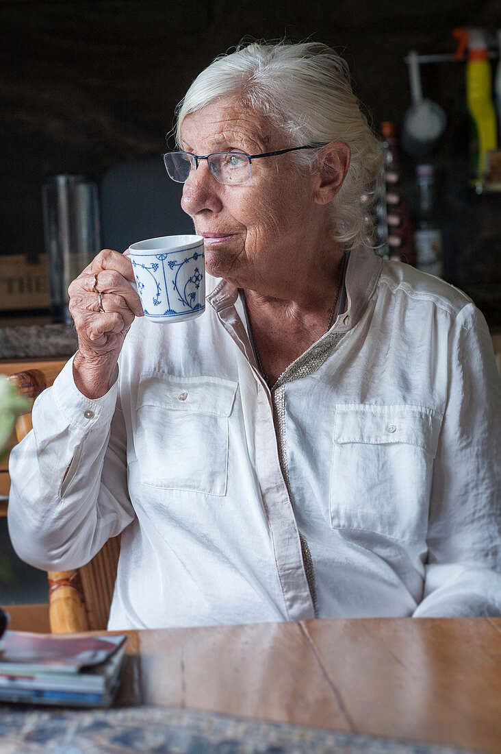 Older woman drinking tea