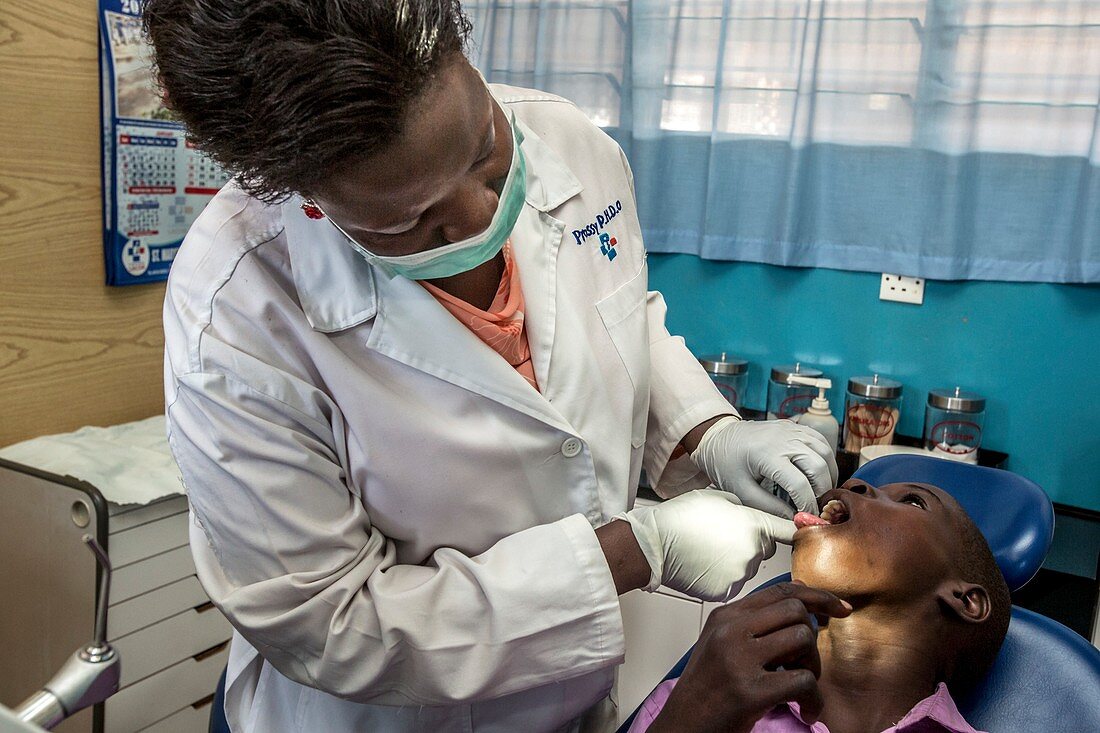 Hospital dentist treating a child
