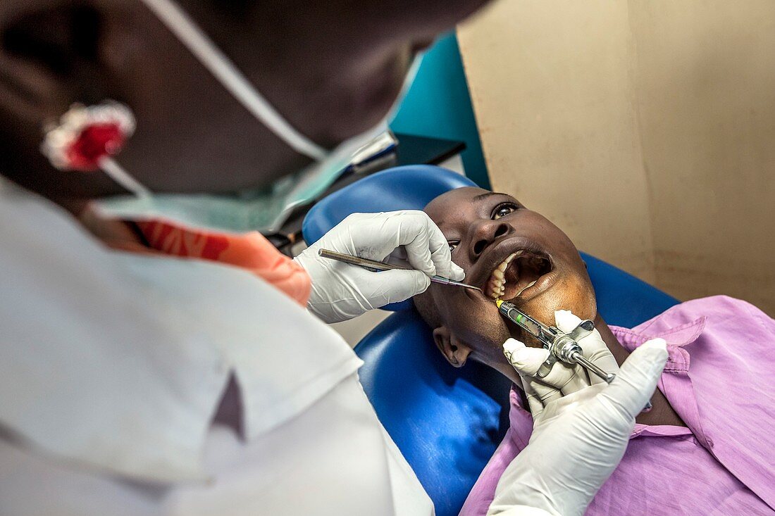 Hospital dentist treating a child