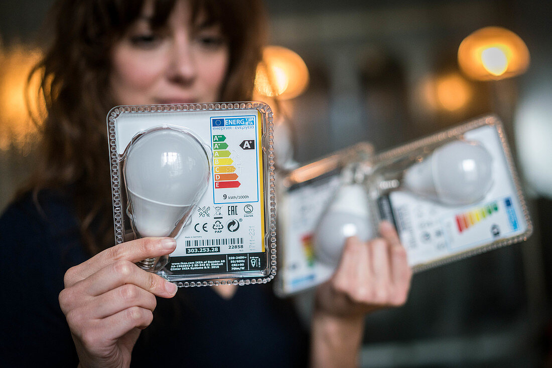 Woman holding LED bulbs