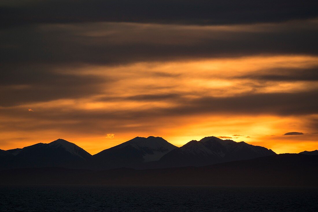 Sunset over coast of Eastern Greenland