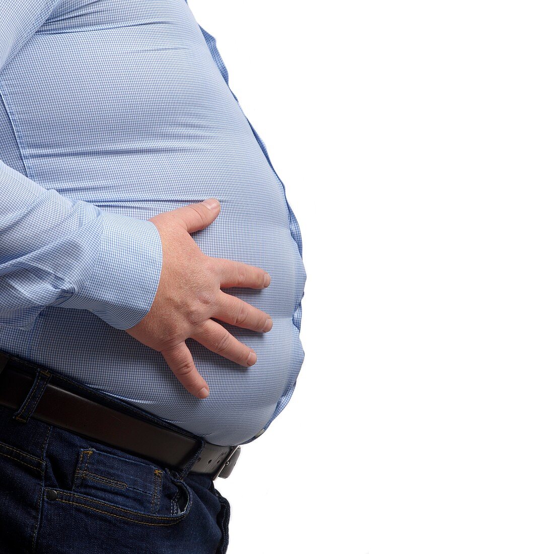 Overweight man touching stomach