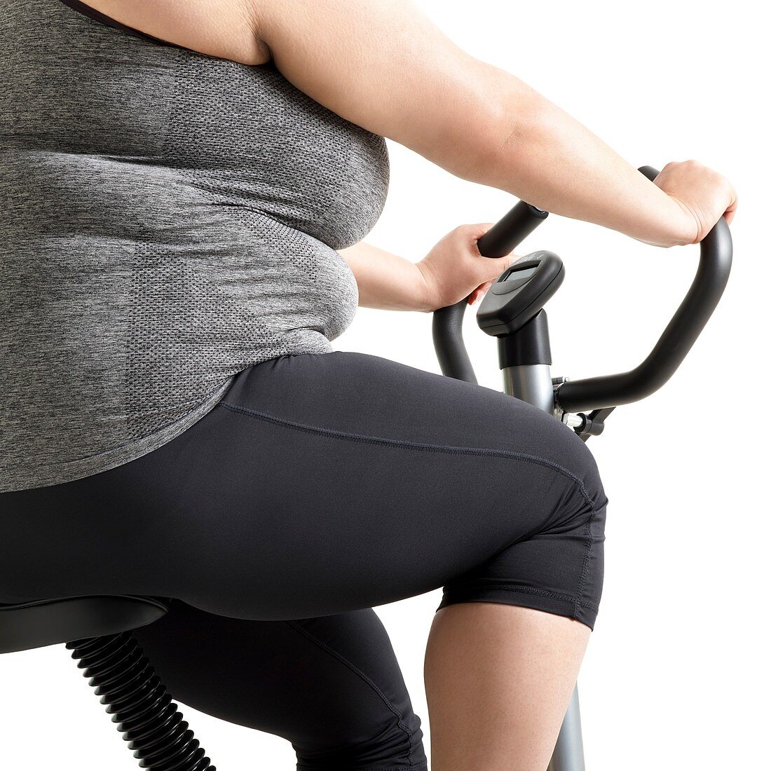 Overweight woman on exercise bike