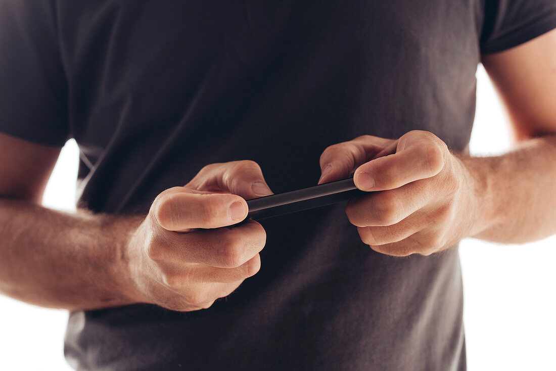 Man playing game on smartphone
