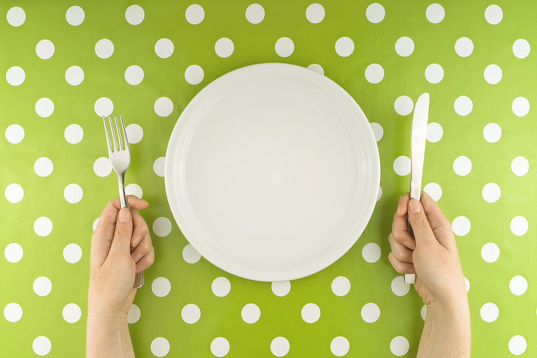 Person with empty plate