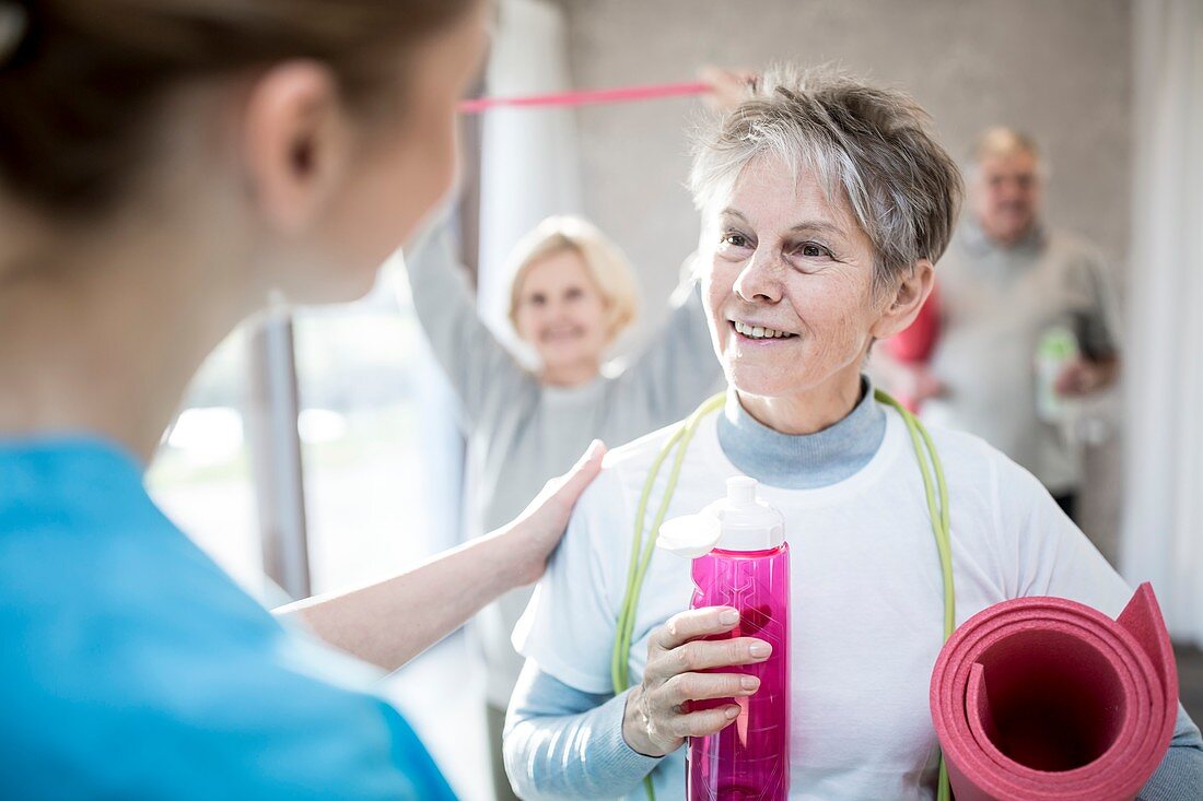 Woman talking to physiotherapist