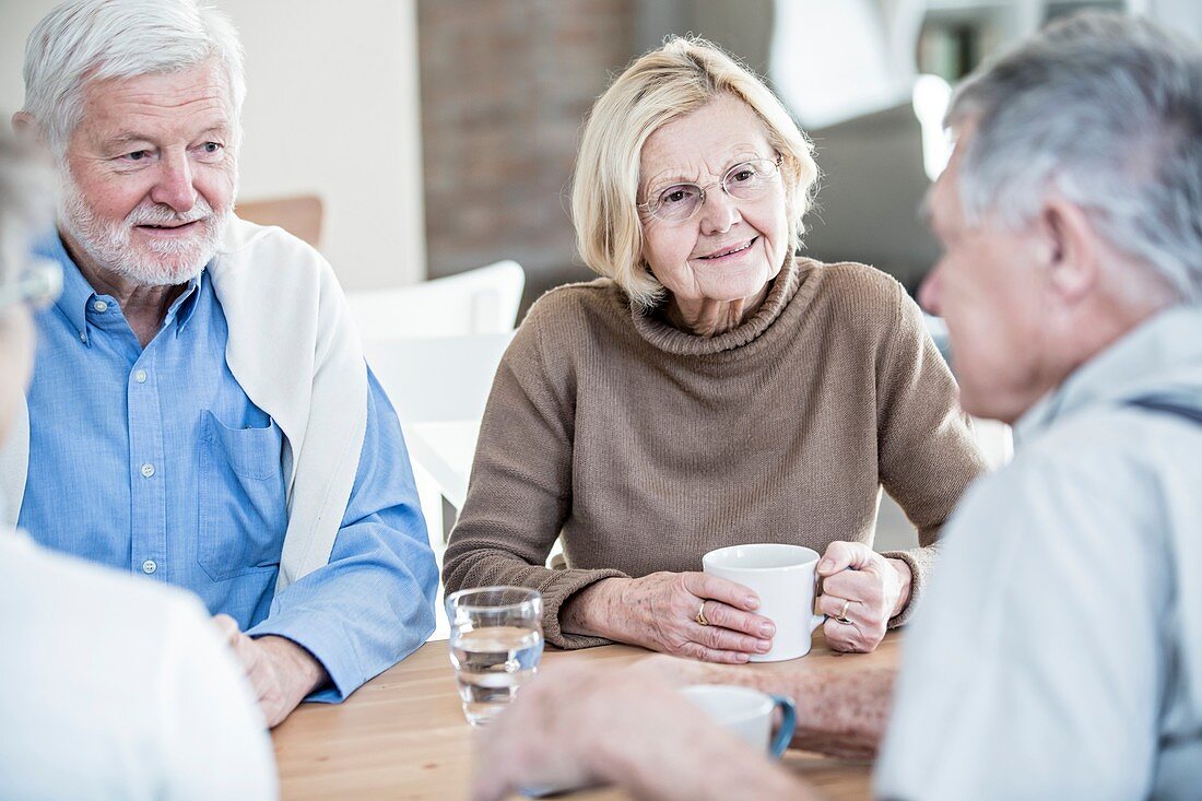 Friends talking in retirement home