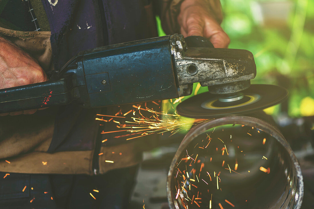 Man using metal grinder