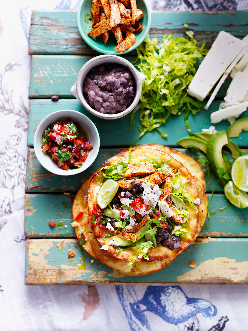 Chicken tostadas with salsa, chicken and salad