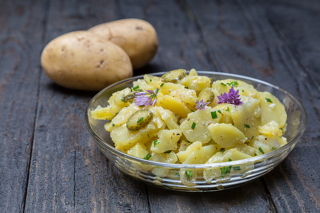 Potato salad with herbs and chive flowers