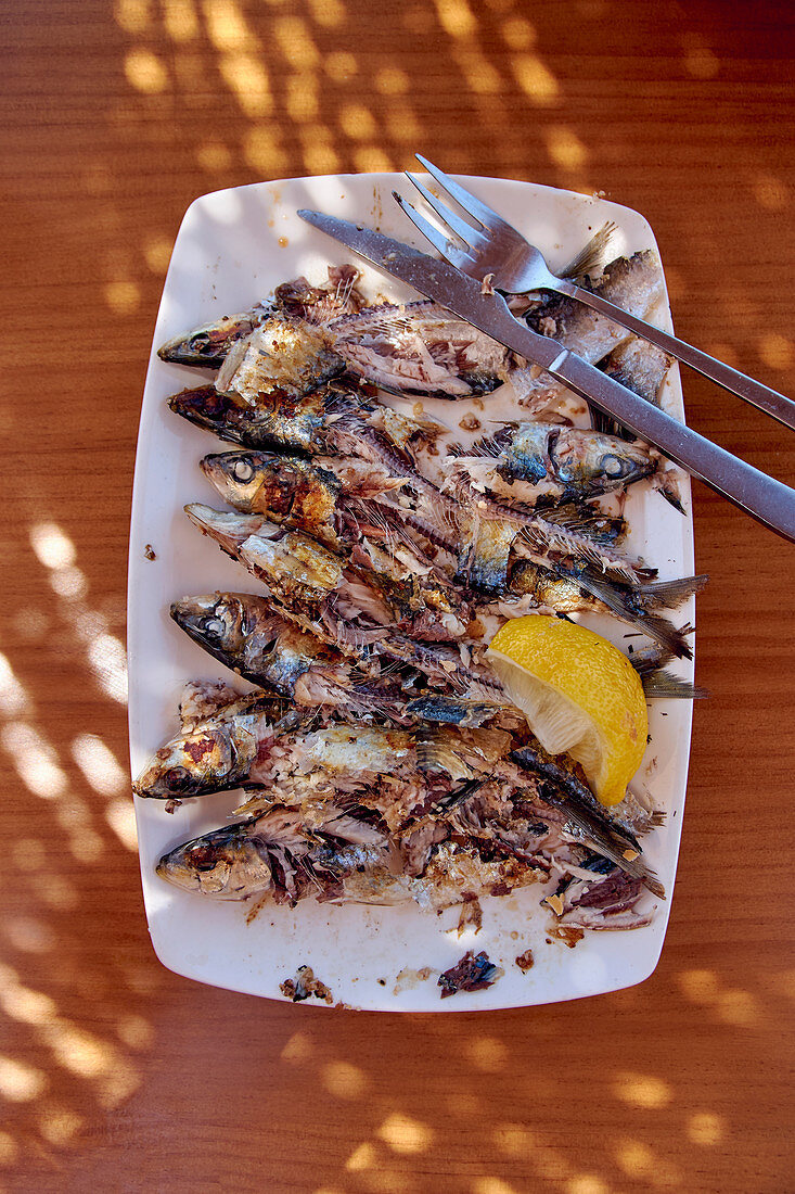 Grilled sardines on a serving platter
