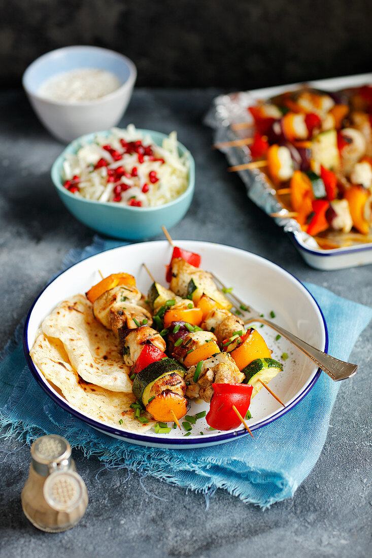 Chicken skewers with vegetabless and home made flatbread