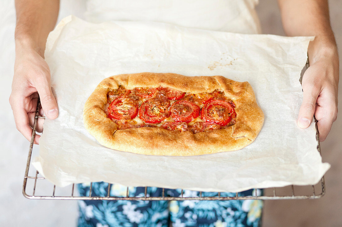 A homemade pizza with tomatoes