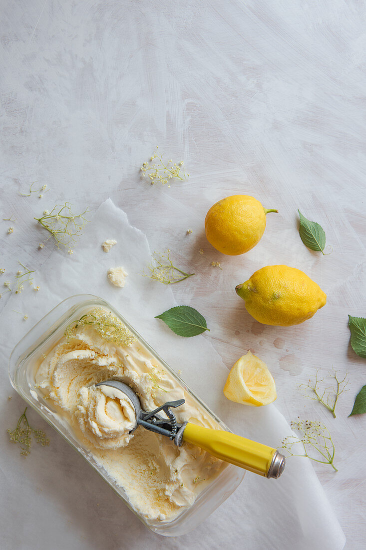 Lemon and elderflower ice cream with an ice cream scoop