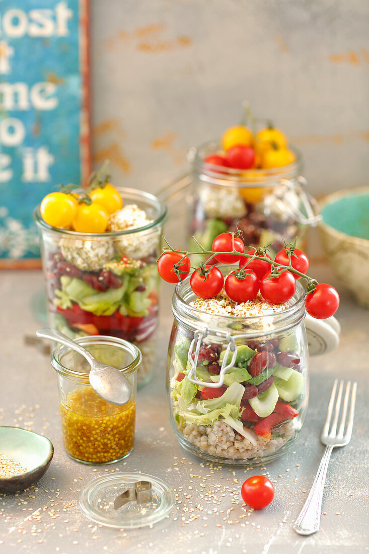 Layered salad in a jar: buckwheat, bean, avo, vegs, quark or feta