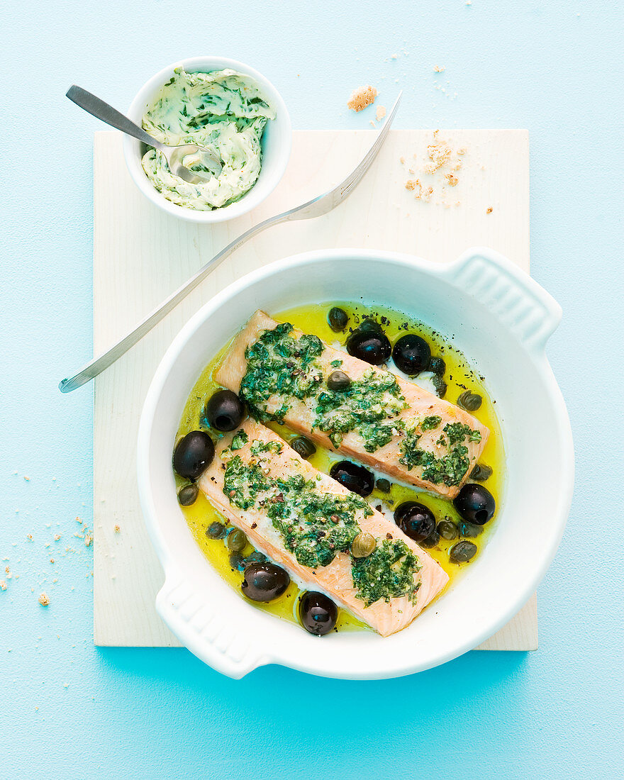 Oven-roasted salmon fillet with basil butter, olives and capers