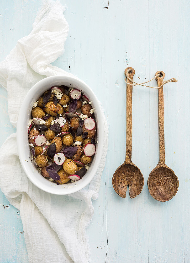 Roast young potato salad with radish and soft cheese