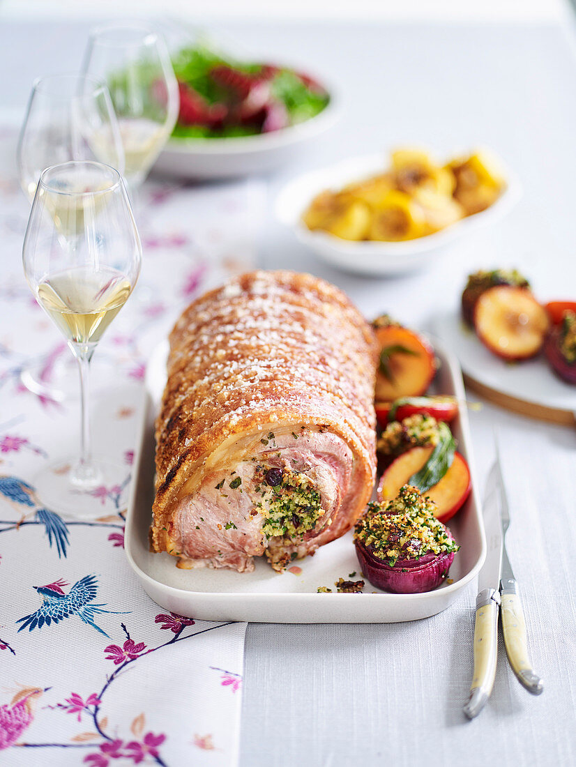 Crispy crackling pork with sweet onions and plums