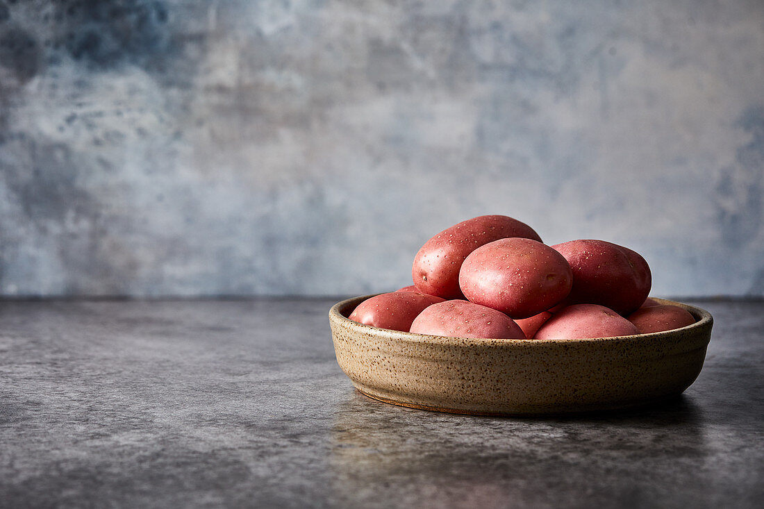 Red potatoes in a ceramic bowl