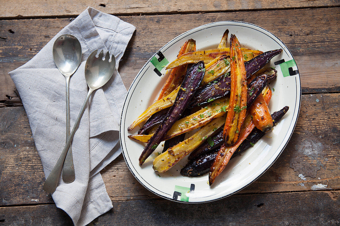 Roasted heritage carrots-with lemon and cumin on a plate