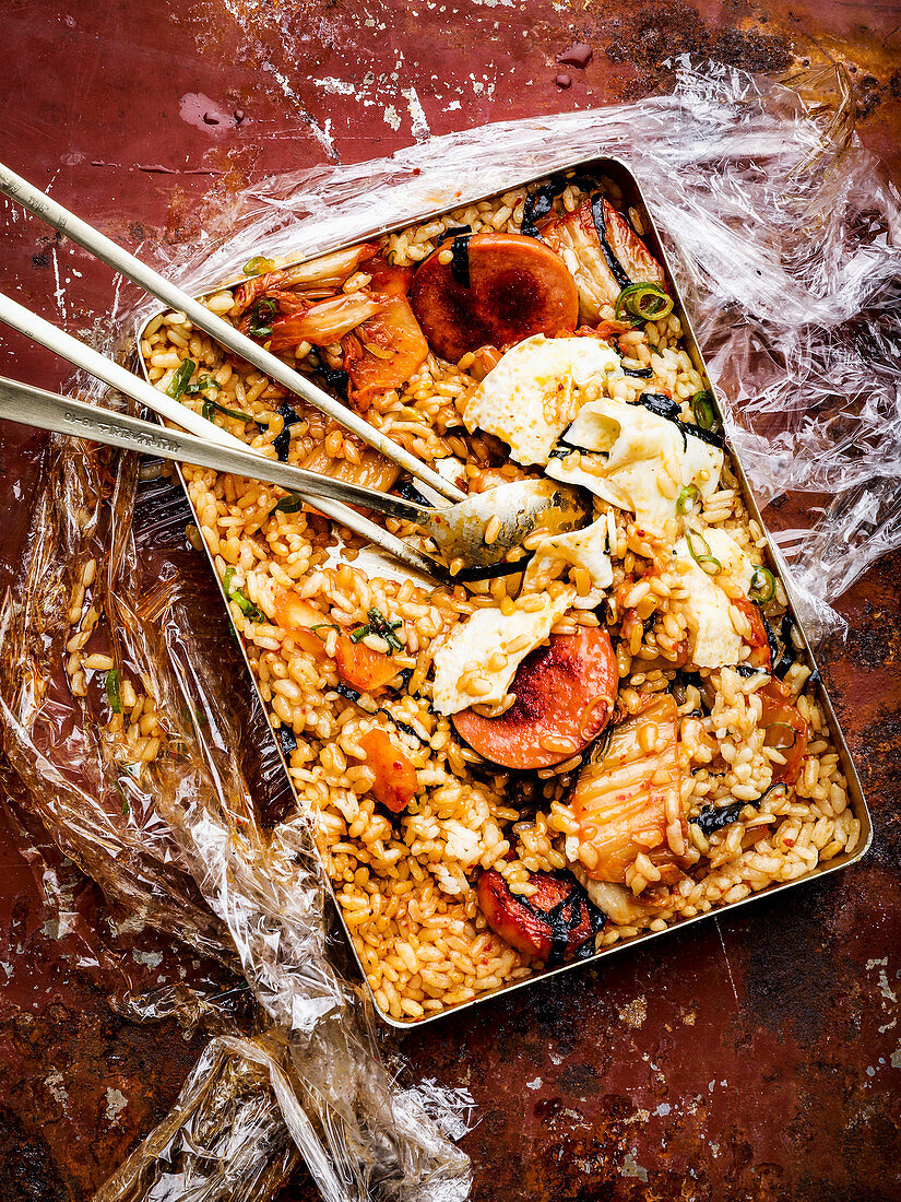 A Korean shaking box with rice and seafood