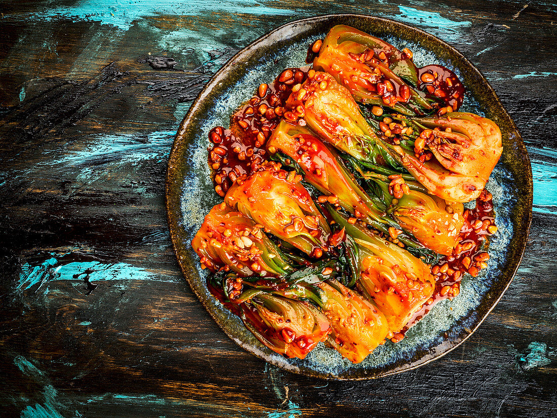 Korean chilli bok choy on a plate (seen from above)