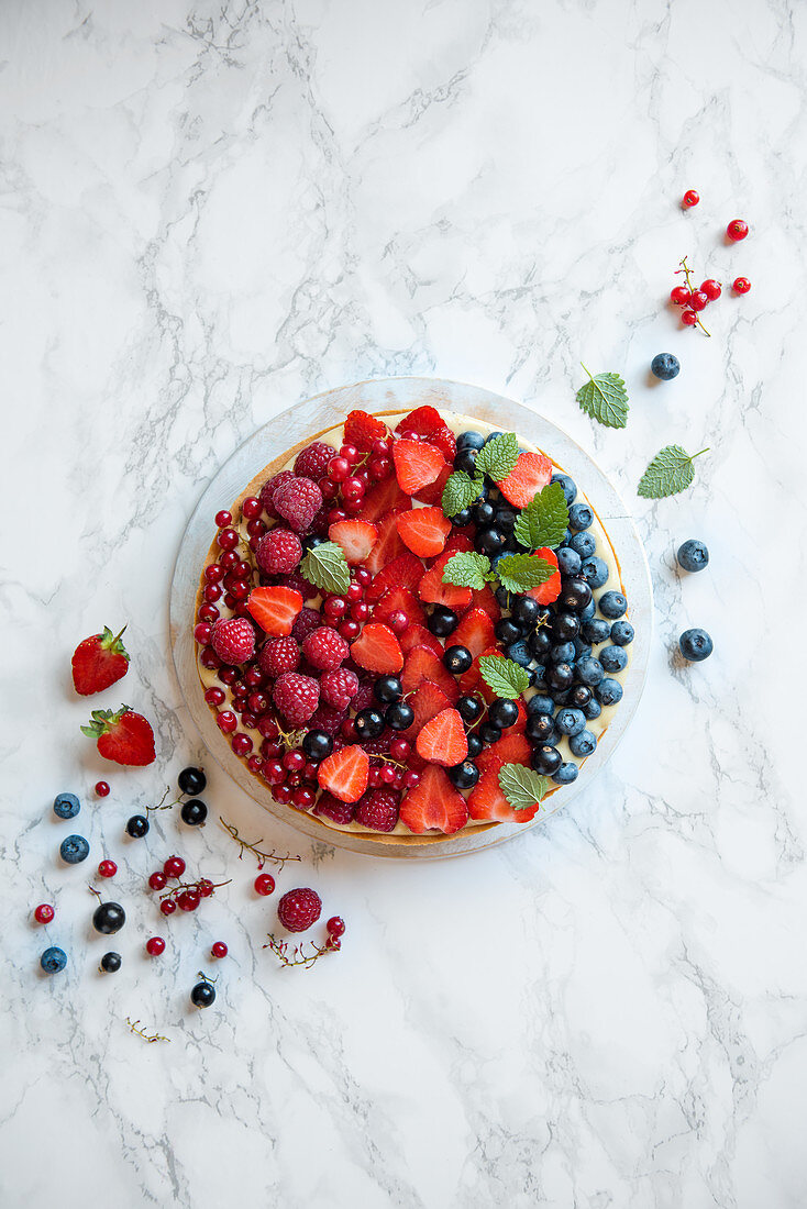 Tart with creme patisserie and summer berries