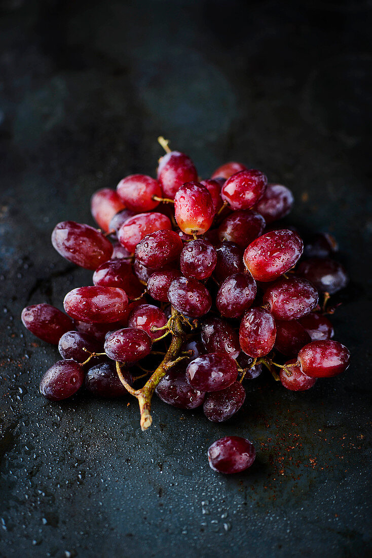 Fresh red grapes on a dark background