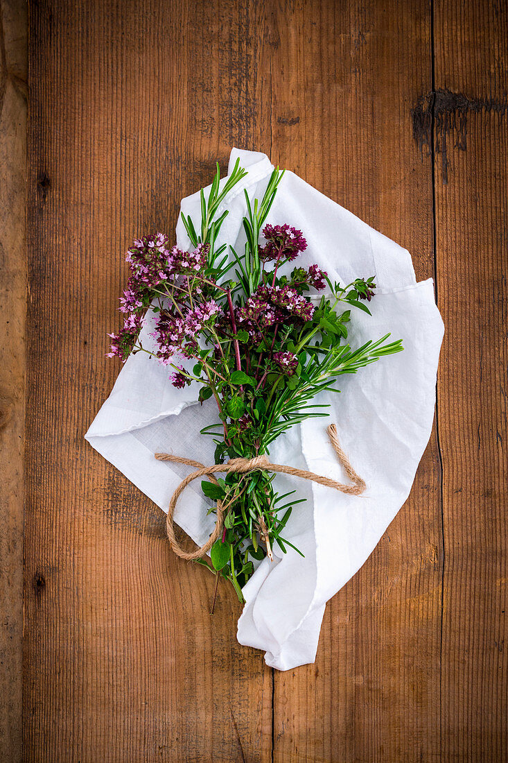 A bunch of fresh rosemary and oregano