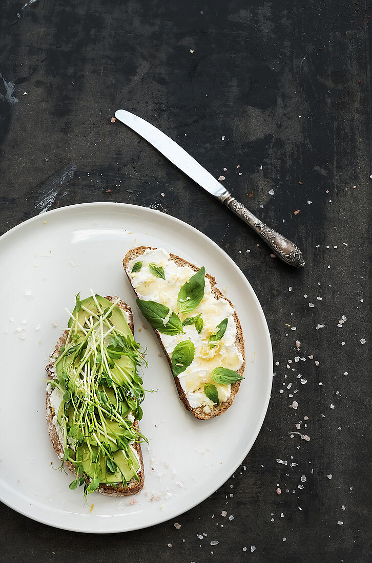 Avocado, ricotta, basil and sprout sandwiches