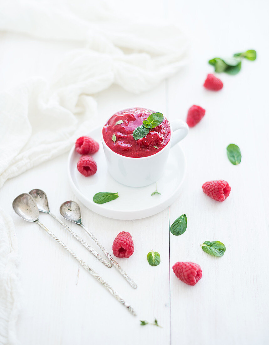 Raspberry sorbet ice-cream with mint leaves