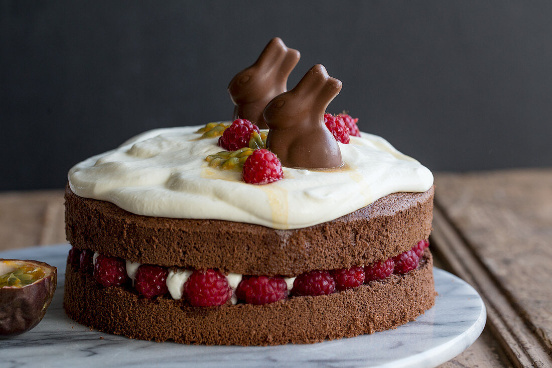 Easter cake with raspberries, sour cream and passion fruit