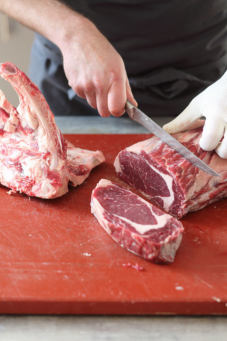 Entrecote (ribeye) being cut