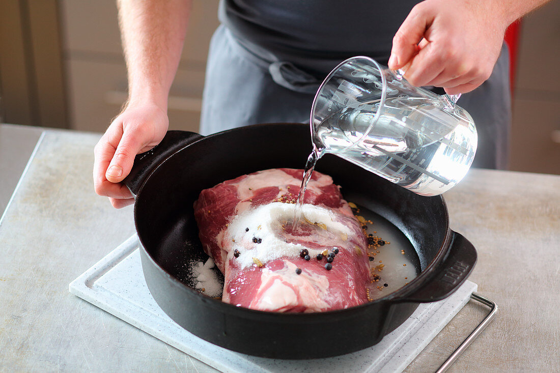 Meat being marinated with salt and sugar