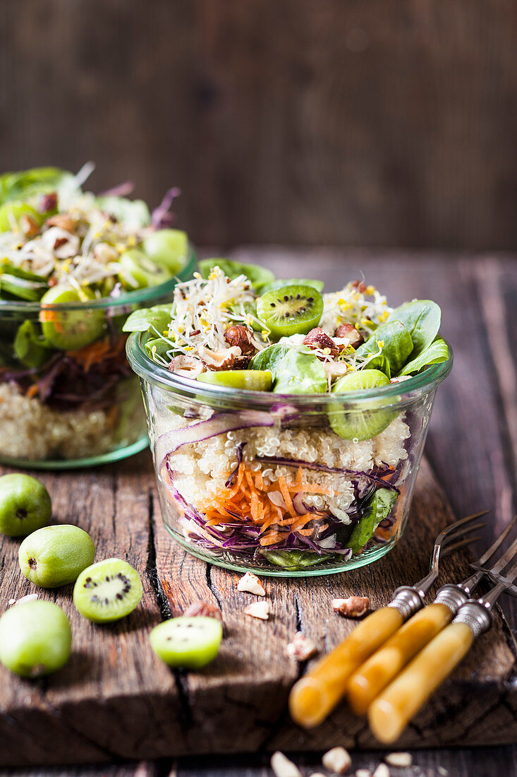 Quinoa salad with corn, mini kiwis, red cabbage, carrots and hazelnuts