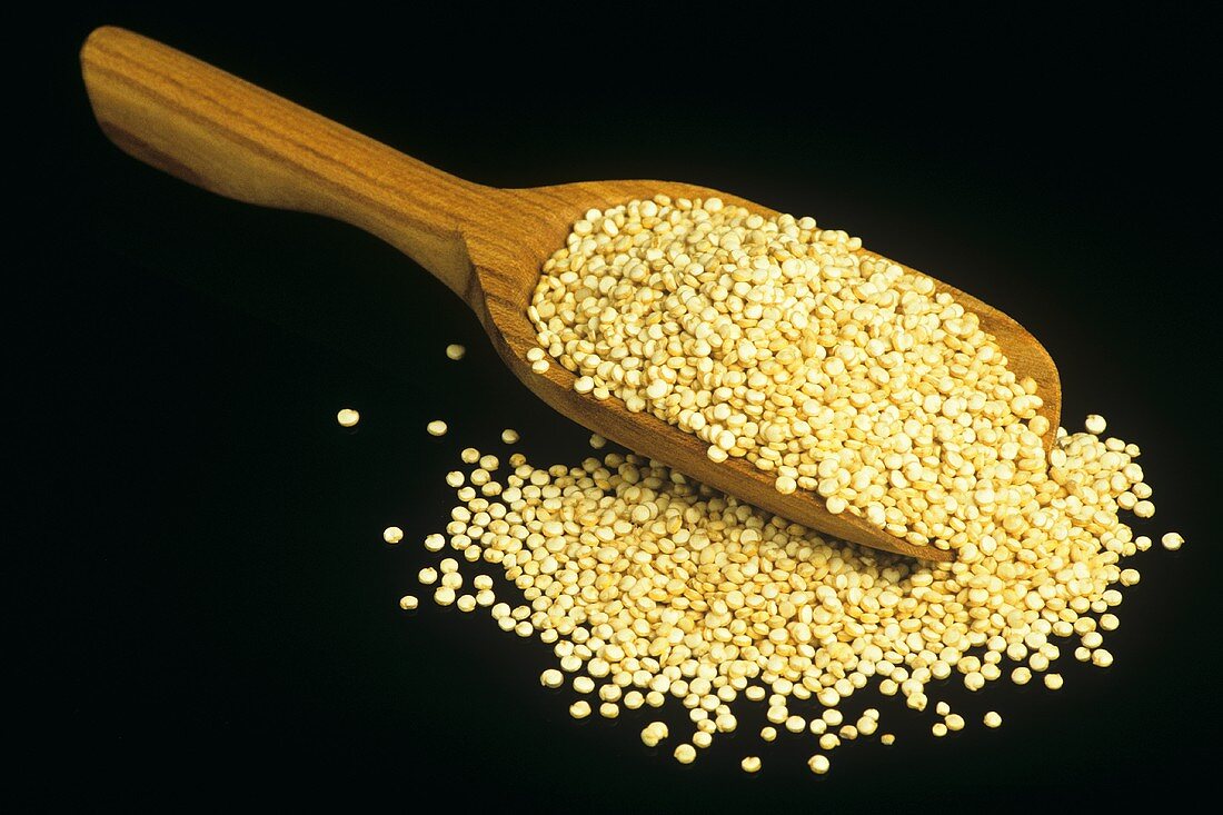 Quinoa on wooden scoop