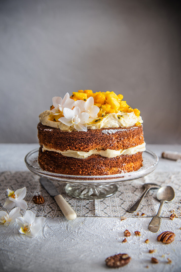 Hummingbird cake – pineapple and banana cake with cream cheese frosting and fruit