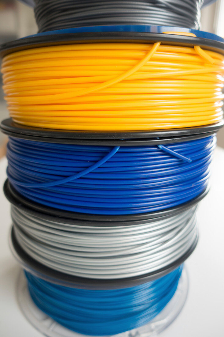 Spools of plastic filaments for 3D printing