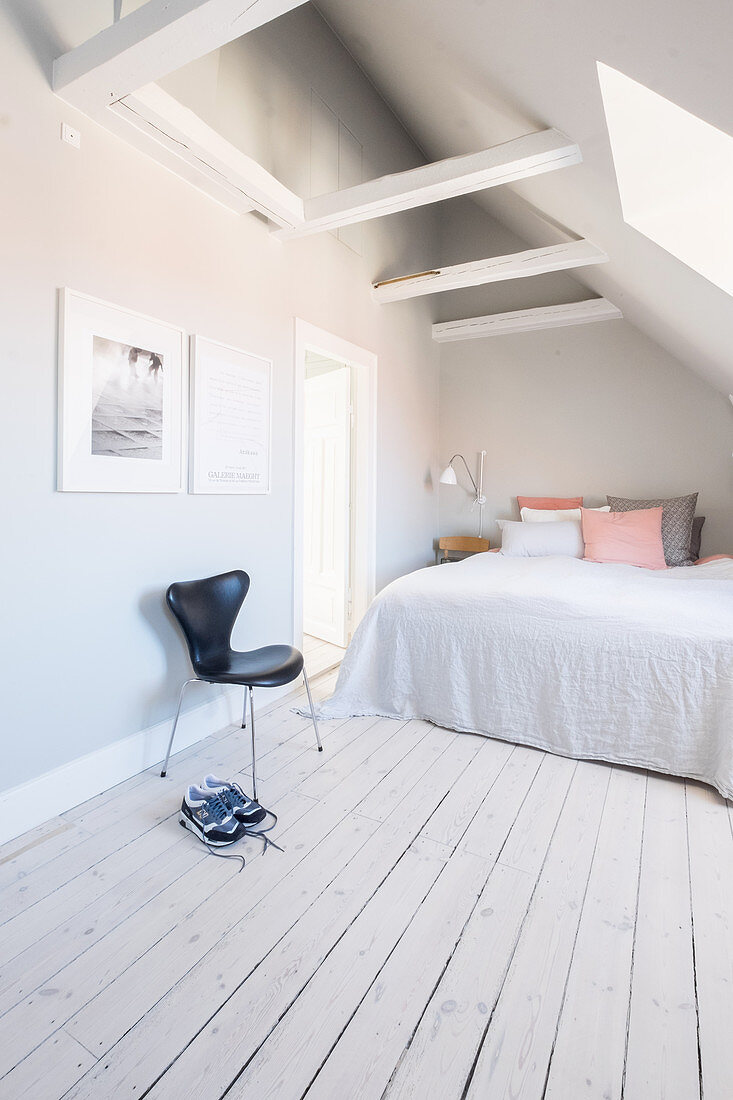 Bright attic bedroom with sloping ceiling