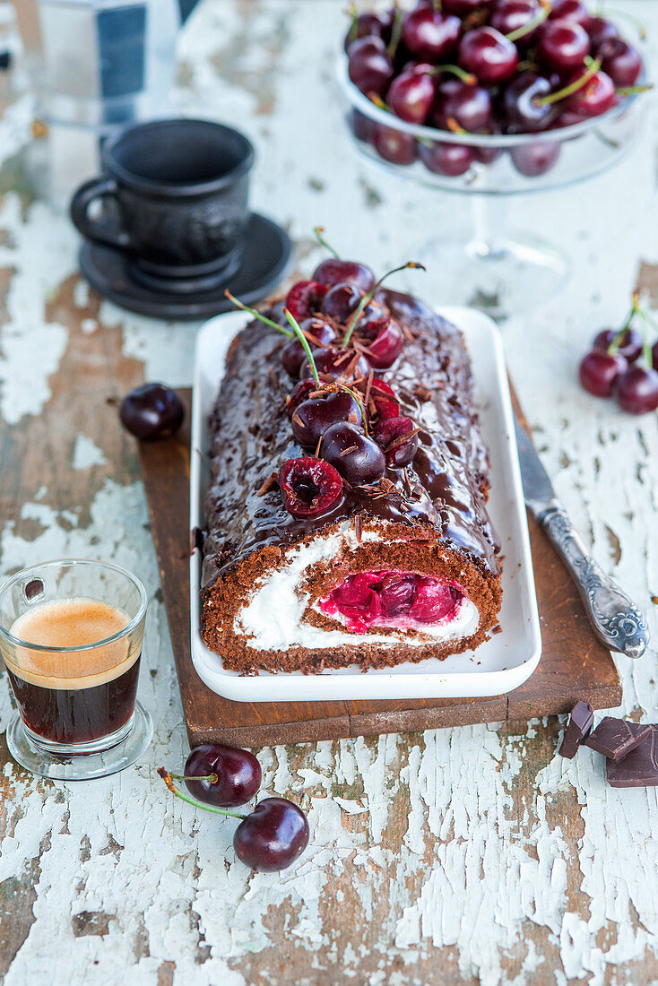 Chocolate biscuit roll with mascarpone cream and cherries