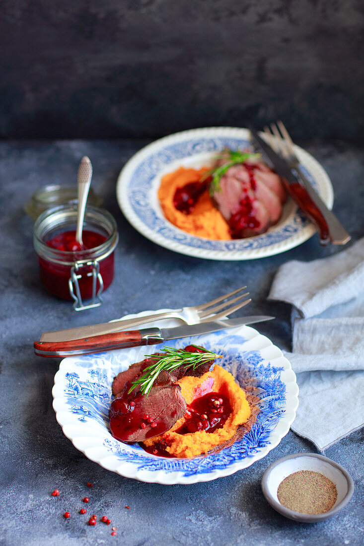 Goose breast with mashed sweet potatoes and sour cherry sauce