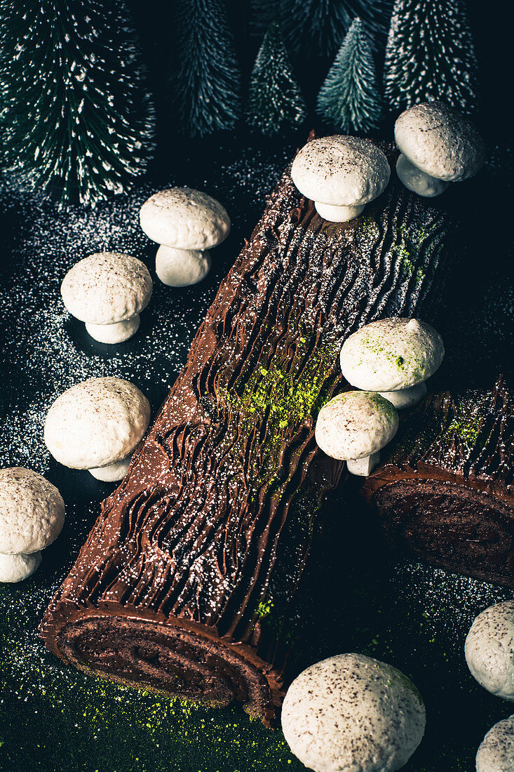 A dark chocolate Yule log with meringue mushrooms